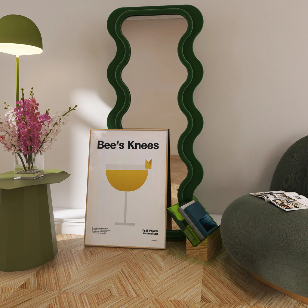 Room interior with a green lamp, framed picture, and wavy green mirror.