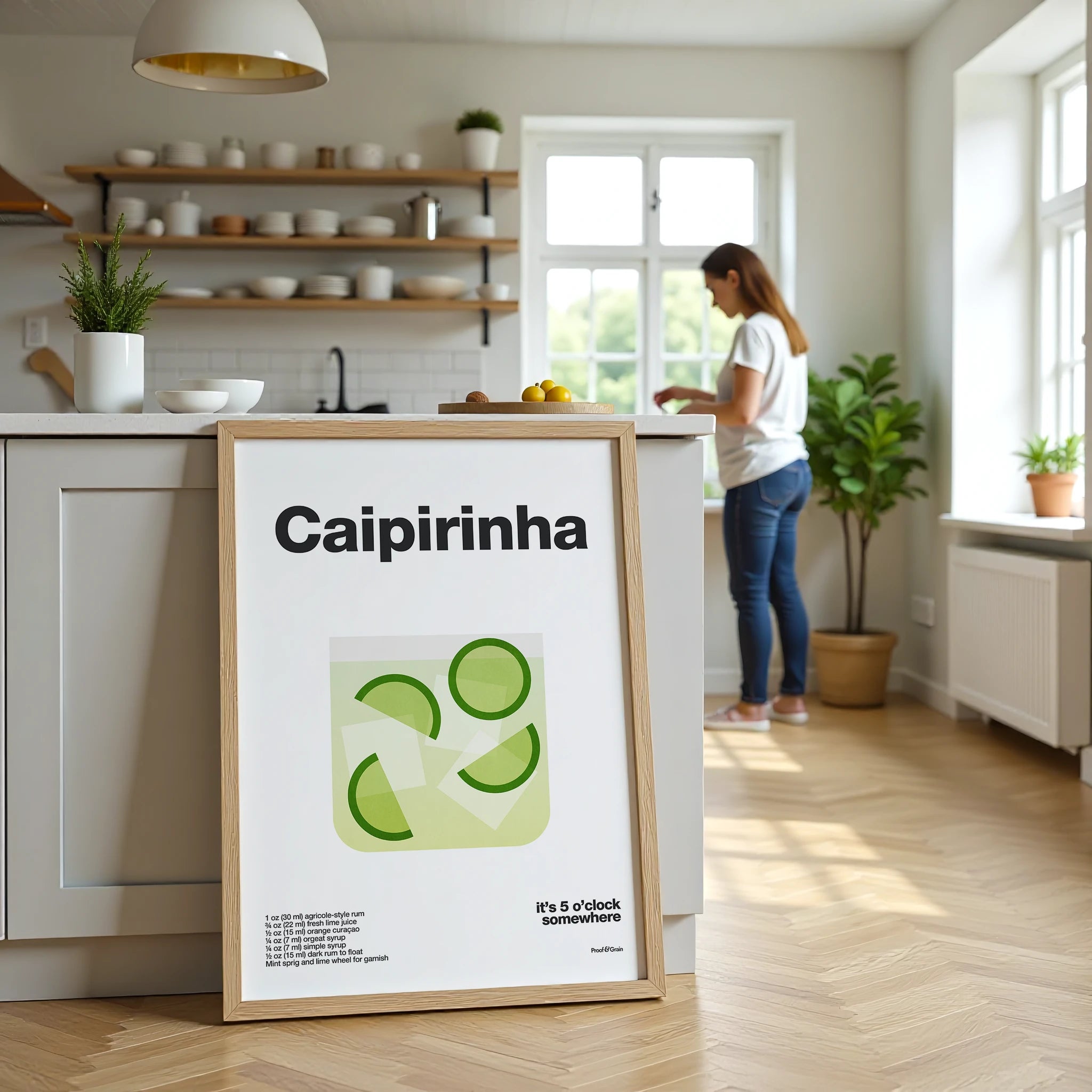 Framed poster with 'Caipirinha' design in a kitchen setting