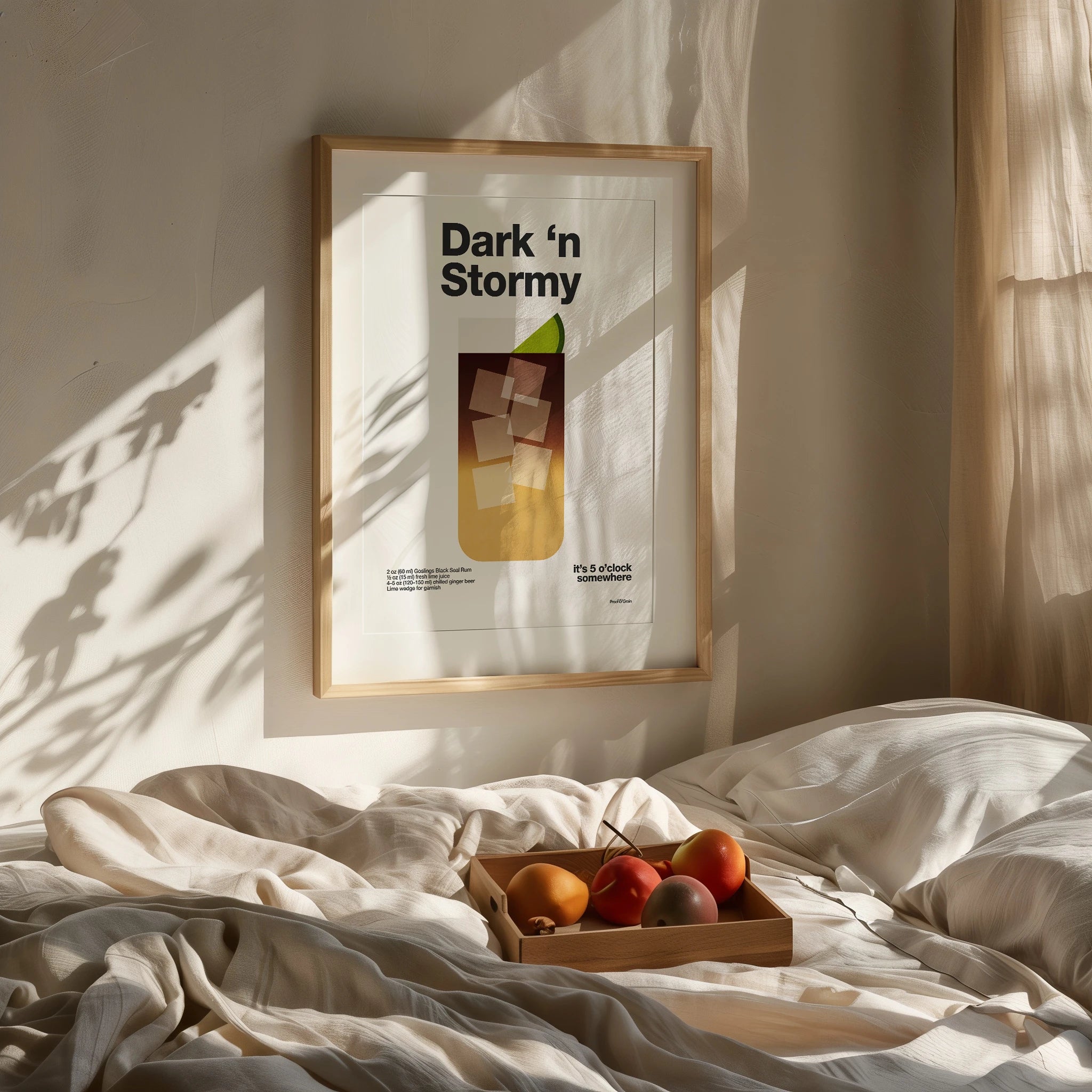 Framed artwork titled 'Dark 'n Stormy' on a wall above a bed with fruit tray.