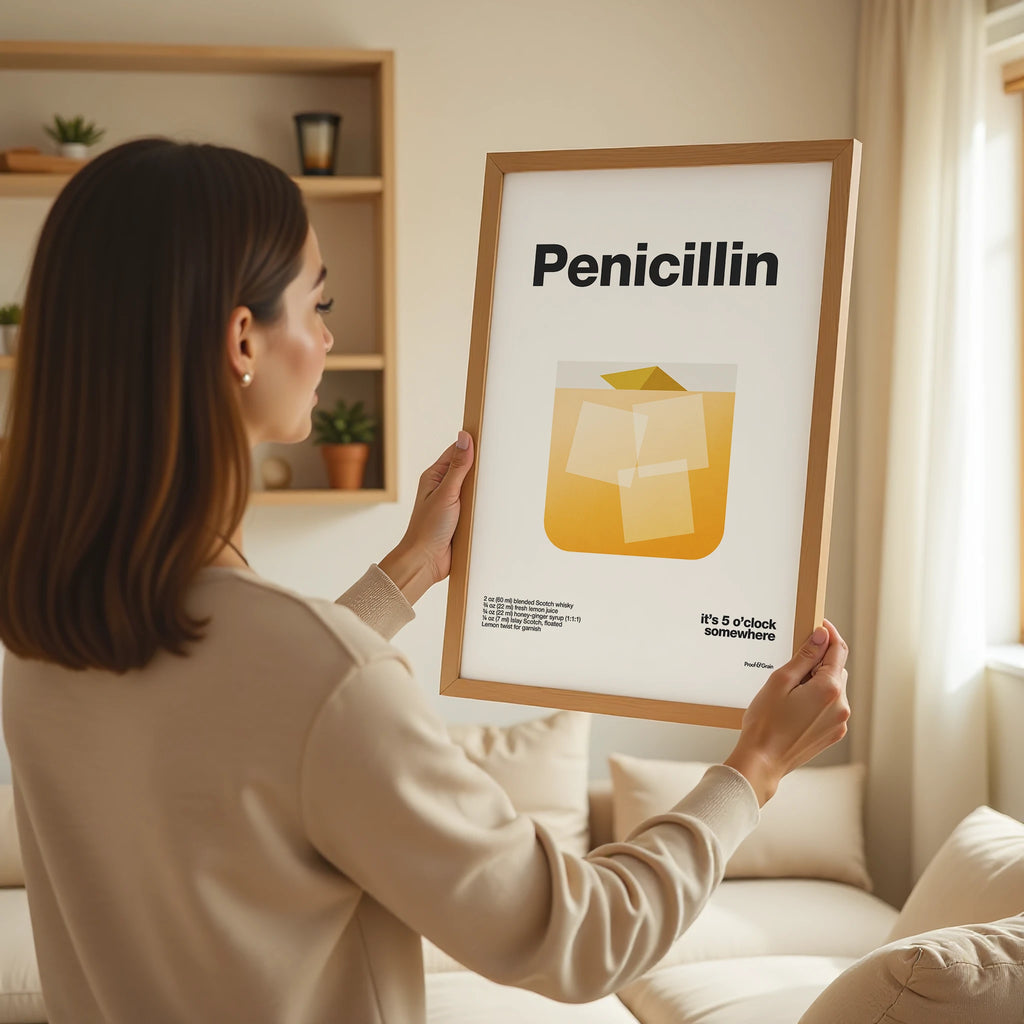 Woman holding a framed picture of penicillin in a living room setting